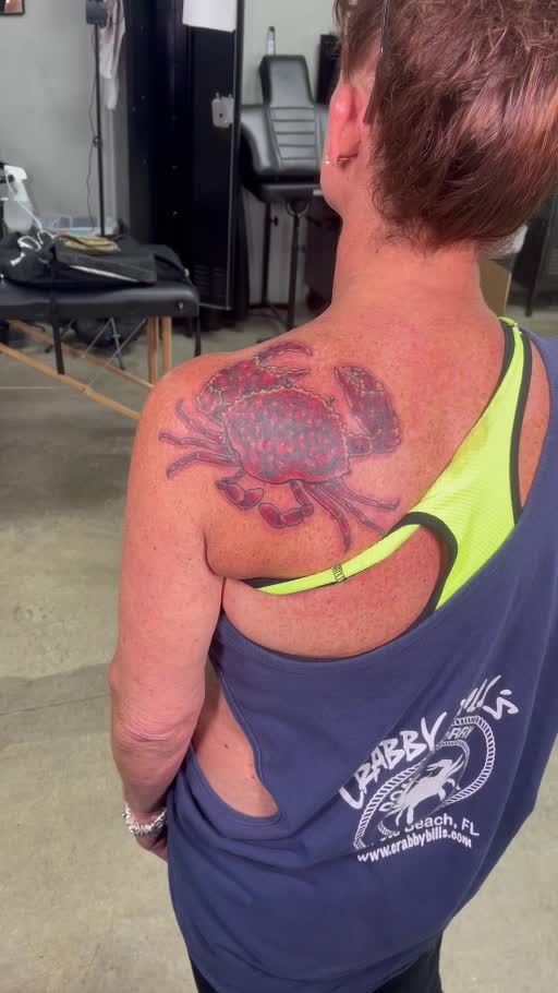 Large floral shoulder and upper-back tattoo