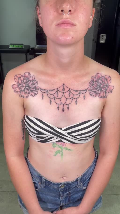 Ornamental collar and chest tattoo
